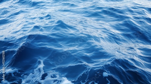 Intricate boat wake patterns on deep blue water surface, ideal for artistic backgrounds and maritime themes photo