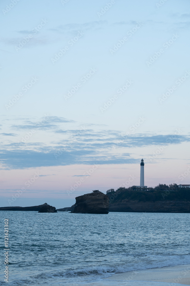 lighthouse on the coast of Biarritz in France at sunset