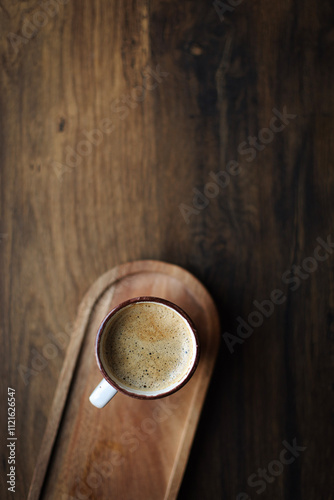 hot cup of coffee on wooden plate, flatlay, cozy autumn or winter holiday