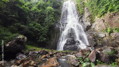 Sunanta Waterfall  in the lush forest park photo