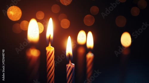 Burning candles with bokeh lights.