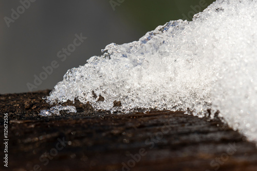 Melting Snow Crystals Sparkle Like Diamonds On Wood