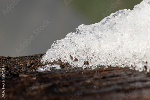 Melting Snow Crystals Sparkle Like Diamonds On Wood