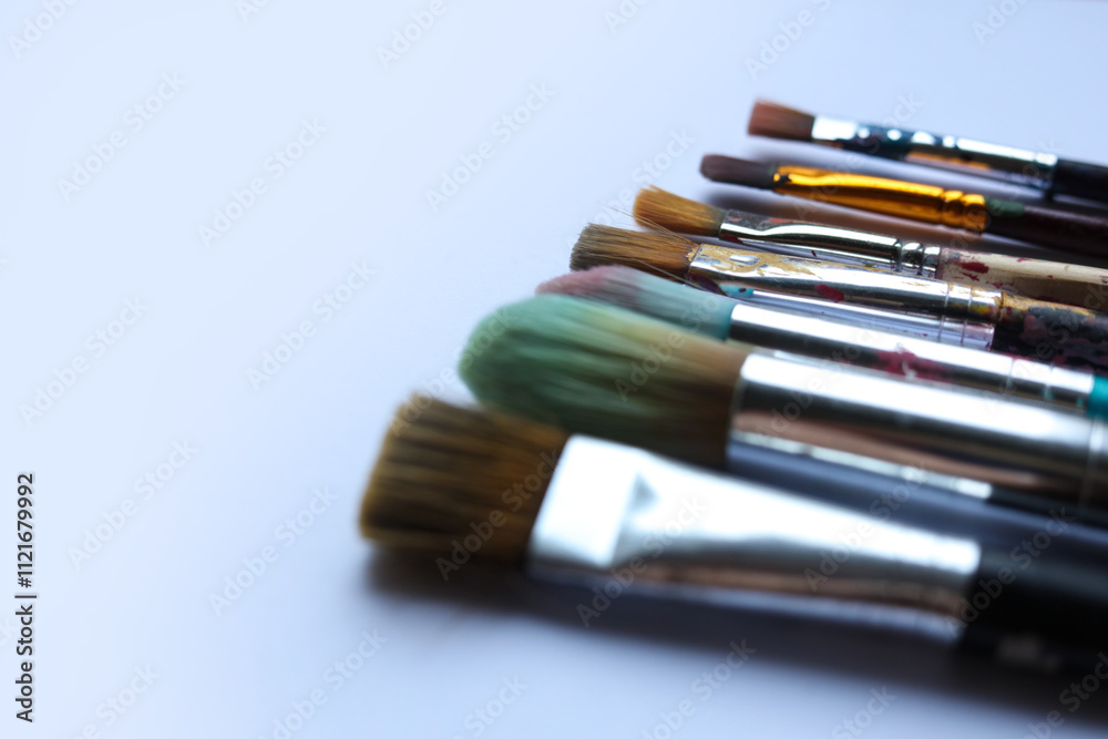 Fototapeta premium Paint brushes on a white background. Top view, flat lay.