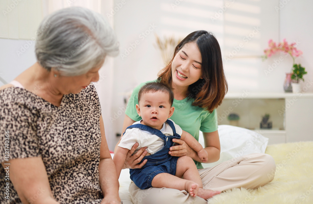 Family concept, smiling mother, baby son and grandmother sitting together at home. Family concept, smiling mother, baby son and grandmother sitting together at home.