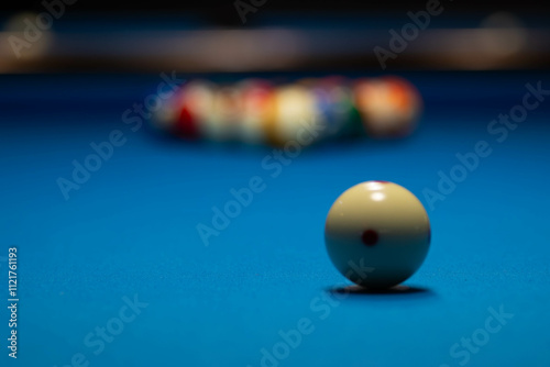Focused Cue Ball with Blurred Pool Balls in the Background