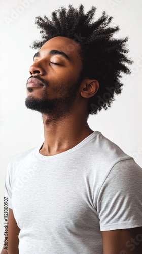 A serene moment captured in a minimalist portrait, showcasing relaxed contemplation and tranquility. The individual embodies peacefulness and introspection against a simple backdrop.