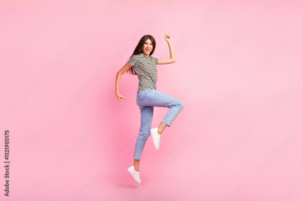 Full body photo of funky millennial lady jump up celebrate victory wear shirt jeans isolated pink color background Full body photo of funky millennial lady jump up celebrate victory wear shirt jeans isolated pink color background