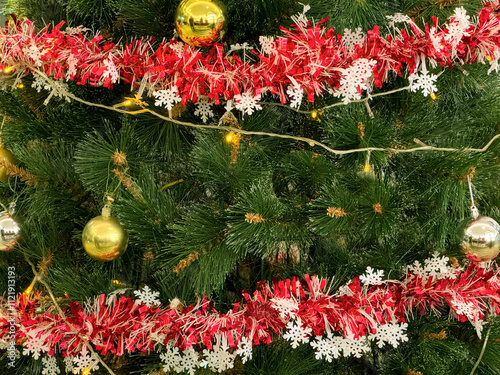 Close up christmas tree decoration from baubles , tinsels, mistletoe, ribbon, snowflakes, and many more. photo