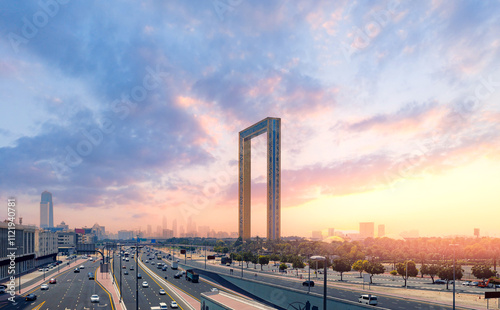 Dubai frame tourist landmark of UAE, United Arab Emirates. Sunset cityscape with skyscrapers