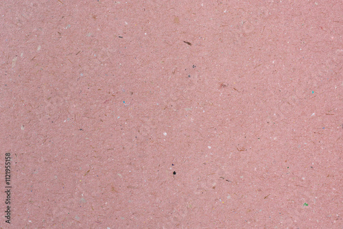 pink cardboard surface, thick rigid paperboard used in book covers, binding boards or crafts, abstract background