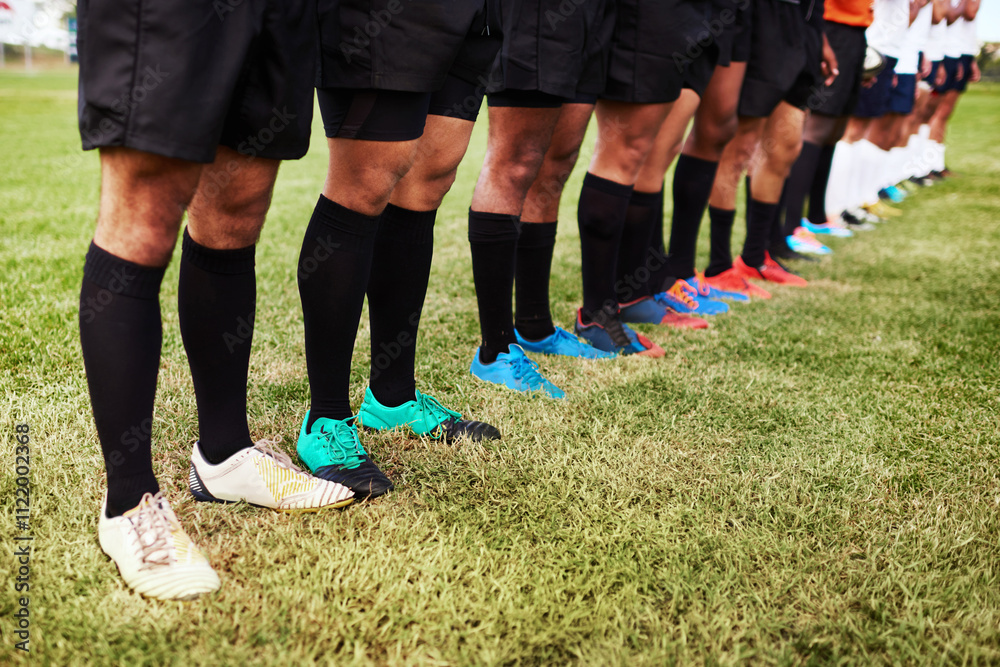Fototapeta premium Grass, line and sports with legs of rugby player team outdoor on field together for start of game. Exercise, fitness and solidarity with athlete group in row at venue for competition or tournament