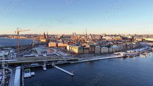 Stockholm old town, aerial view, winter and snow, clear blue sky, sunset