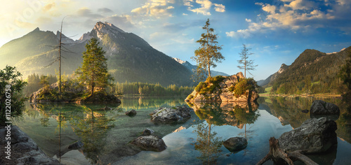 Painterly lake scenery with mountains, nice sky and morning sunlight photo