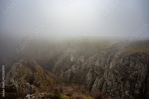 Mysterious fog shrouding the tureni gorge canyon in apuseni natural park, transylvania, romania, creating an evocative and captivating landscape photo