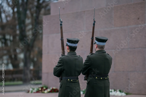 Couple of latvian guards with rifles and bayonets standing in guard in Riga, Latvia photo