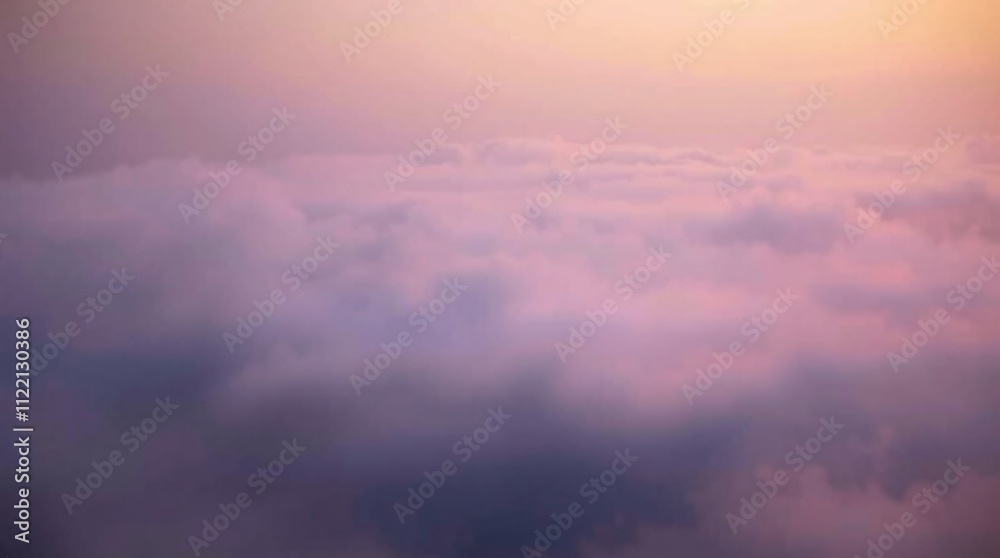 Obraz premium Celestial Canvas: A breathtaking panoramic vista of ethereal clouds bathed in the soft glow of a golden sunset, capturing the serene beauty of nature's artistry. 