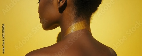 Shoulder of an unidentified woman with sunscreen applied to her skin