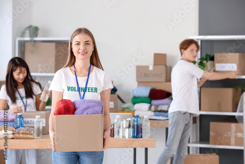 Young female volunteer with...
