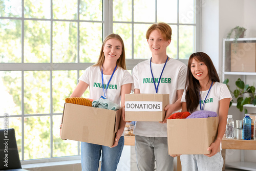 Young volunteers with donat...