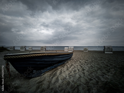 On the beach of Sierksdorf in front of a dark clouds backdrop photo