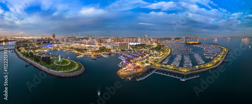Rainbow harbor with walk paths and boats docked.
