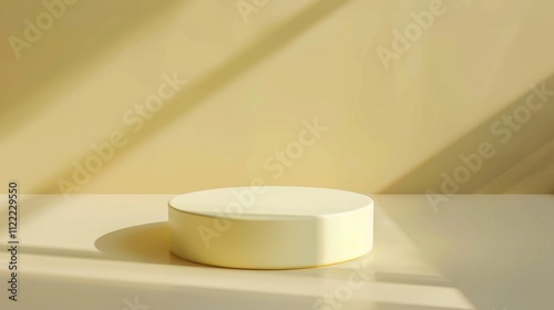 Cream-colored round podium on a beige background, illuminated by warm light and intersected with soft shadows. Perfect for product displays or presentations photo