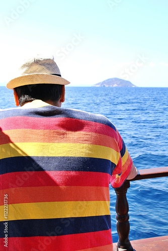man on a ship watching the sea, man looking at the sea