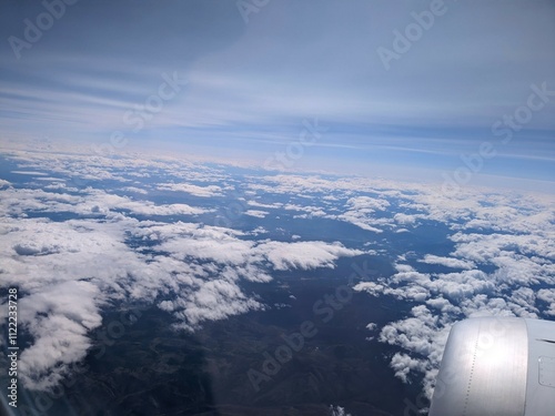 Flying between the white clouds. View from the airplane window. Canada