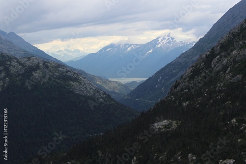 Deep valley and clouds hanging over the top of mountains in Southern Alaska