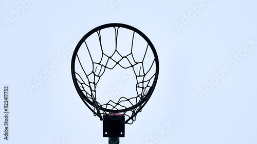 Basketball hoop with white sky in horizontal position. View taken from below. photo