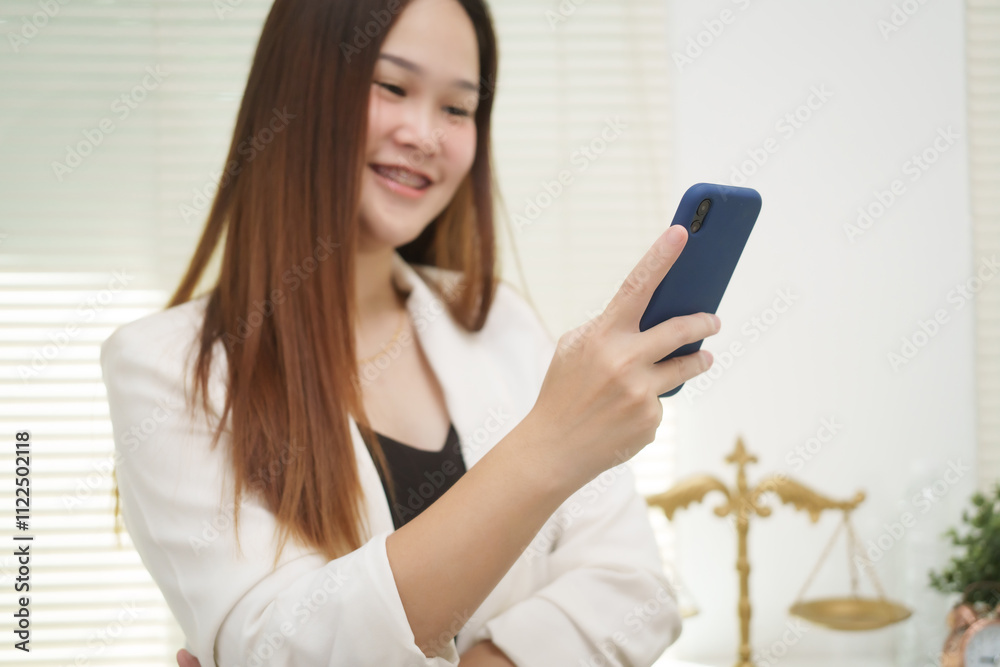 A cheerful businesswoman works at her office desk as a legal consultant, handling online civil cases, including debt disputes, unfair dismissals, foreclosures, land redemptions, with professionalism A cheerful businesswoman works at her office desk as a legal consultant, handling online civil cases, including debt disputes, unfair dismissals, foreclosures, land redemptions, with professionalism