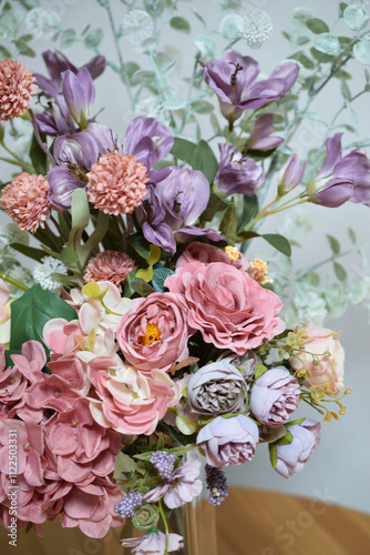 Image of a beautiful bouquet of flowers in a vase taken indoors