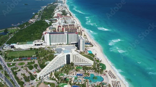 Beautiful aerial perspective of Cancun's Hotel Zone as seen from El Mirador, featuring turquoise waters, sandy beaches, and tropical landscapes