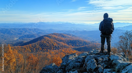 A person gazing out from a mountaintop, taking in the breathtaking view, filled with clarity and focus  photo