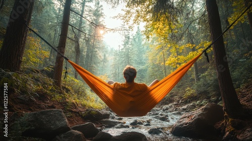 A person lying on a hammock in a tranquil forest, immersed in a moment of stillness and relaxation 