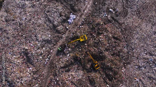 Landfill full of thrash and plastic, huge garbage dump overfilled, waste piles. Environment pollution, ecology problem, unsorted non-recyclable waste