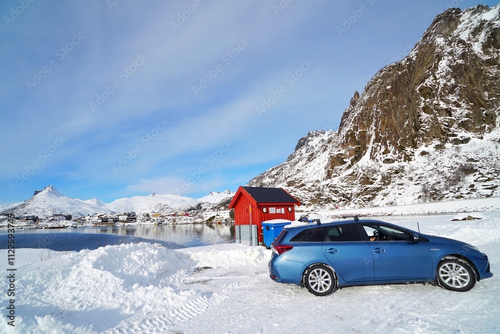 A car with fisherman village background.
