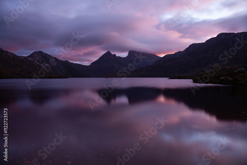 Cradle Mountain with  a mystical sunrise and mist over the summit. Dove Lake, Cradle Mountain-Lake St Clair National Park in Tasmania. photo