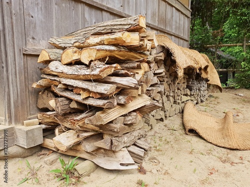 Chopped fire wood stacked in a pile prepared for winter