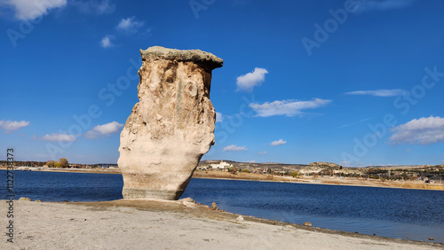 A striking rock formation by the side of Lake Emre in Ihsaniye district in Afyon, Turkey. It is located in the Phrygian Nature park. photo