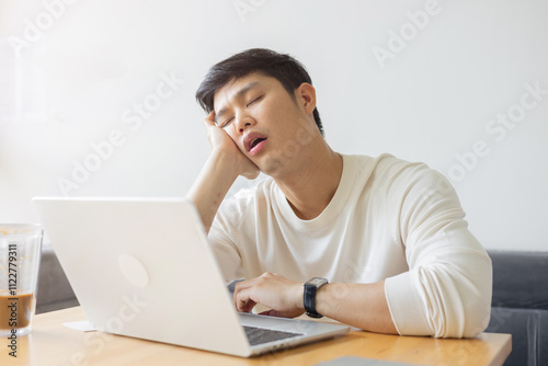 close up young employee man take a nap in the day feeling lazy and sleepy after break time at office , lifestyle people concept
