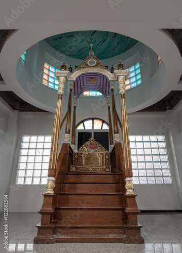 Obraz na płótnie Ornately decorated minbar pulpit from where prayers are led standing on a platform at Safirusslam Mosque. Islamic Affairs, use it as your Wallpaper, Poster and Space for text. Selective focus. w salonie