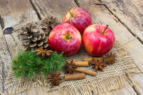 fresh apples, cinnamon sticks and star anise spices - christmas time photo