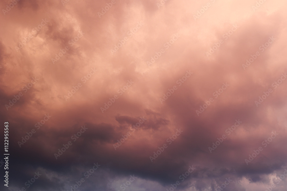 Obraz premium Dramatic storm clouds in the summer sunset. Dark, heavy, dramatic and colorful summer storm clouds, background, texture 