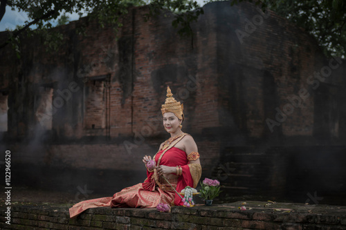 women in traditional clothing  on Buddhist on background.  Portrait women in traditional clothing , Thai traditional  in Ayutthaya, Thailand. photo