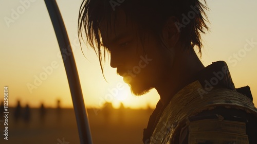 Silhouette of a warrior at sunset in a desert. photo