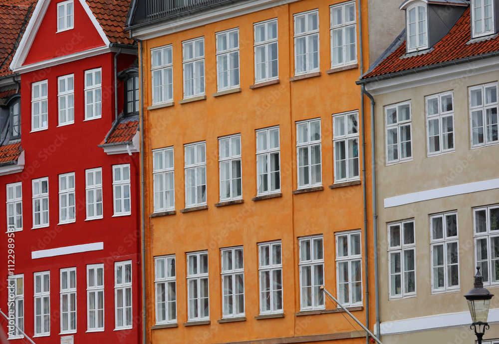 Fototapeta premium facades of the typical houses in the area called Nyhavn in the city of Copenhagen, the capital of Denmark in Northern Europe
