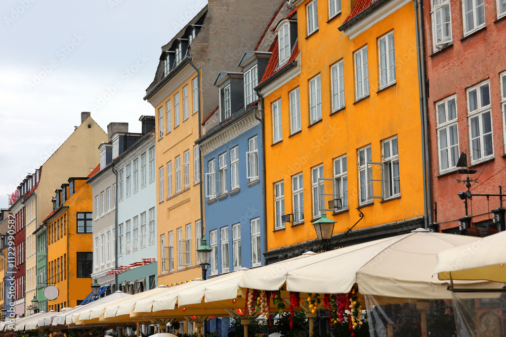 Fototapeta premium typical colorful houses in the area called nyhavn in the city of copenhagen which is the capital of denmark in europe