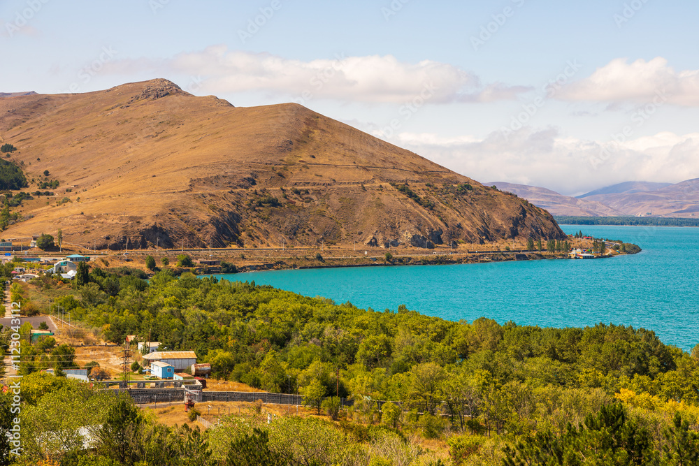 Fototapeta premium Sevan, tourist town by the lake. Sevan Lake. Mountain around. Armenia.